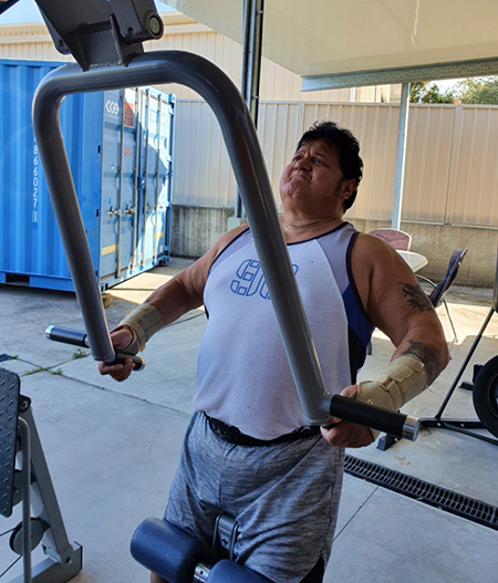 Mike regaining strength in his home gym