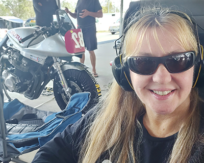 Miranda supporting her husband at a motorbike event